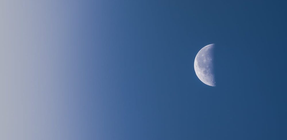 pexels-photo-10747644-10747644 Capture of a half moon against a serene blue sky, perfect for backgrounds.
