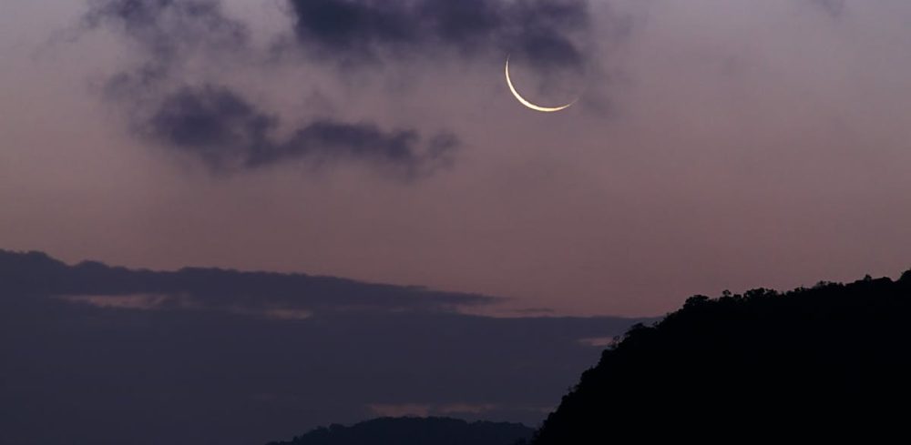 pexels-photo-4100130-4100130 Crescent moon with dark clouds in twilight sky over Phang-nga, Thailand.